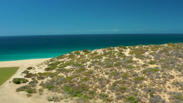 LA LAGUNA BEACH LOS CABOS MEXICO-2021: Coastal Dune and Sandy Beach by Turquoise Ocean