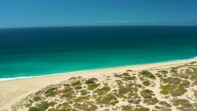 LA LAGUNA BEACH LOS CABOS MEXICO-2021: Coastal Dunes Transitioning to Sandy Beach