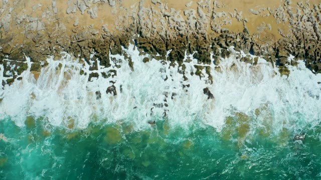 LA LAGUNA BEACH LOS CABOS MEXICO-2021: Waves Breaking on Rocky Beach From Above