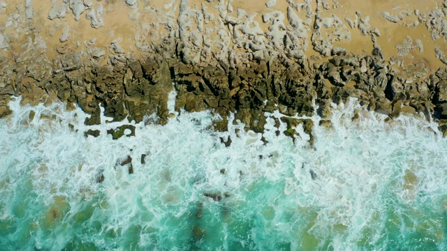 LA LAGUNA BEACH LOS CABOS MEXICO-2021: Waves Crashing on Rocky Coastline