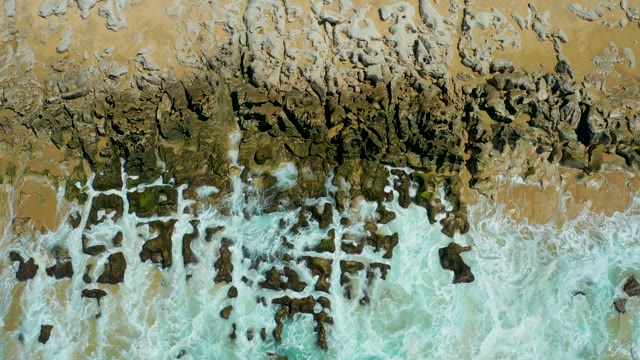 LA LAGUNA BEACH LOS CABOS MEXICO-2021: Waves Crashing Against Rocky Shore