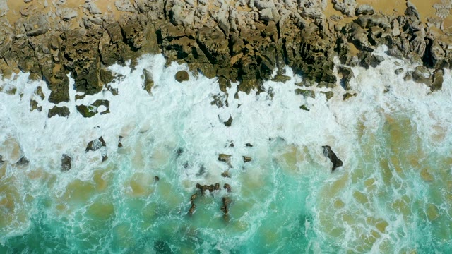 LA LAGUNA BEACH LOS CABOS MEXICO-2021: Waves Crashing on Rocky Coastline