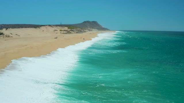 LA LAGUNA BEACH LOS CABOS MEXICO-2021: Waves Crashing on Sandy Beach