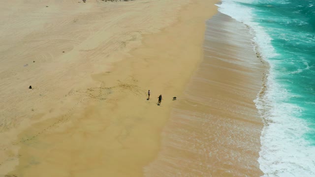 LA LAGUNA BEACH LOS CABOS MEXICO-2021: People Strolling on Sandy Beach Shoreline