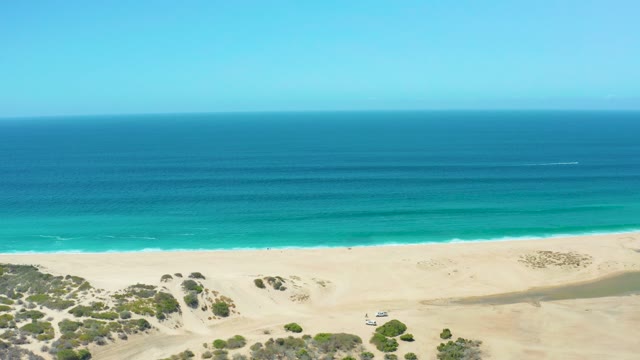 LA LAGUNA BEACH LOS CABOS MEXICO-2021: 4x4 Vehicle Driving on Sandy Beach Coastline