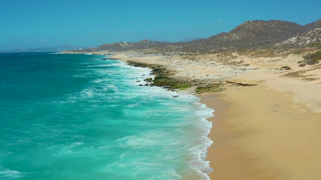 LA LAGUNA BEACH LOS CABOS MEXICO-2021: Ocean Waves on Sandy Beach From Aerial View