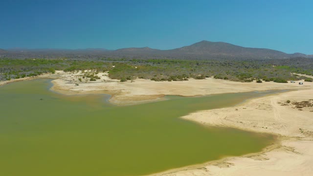LA LAGUNA BEACH LOS CABOS MEXICO-2021: Rising Water Submerges Dry Riverbed
