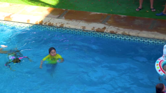 SAN JOSE DEL CABO BCS MEXICO-2020: Children Swimming and Playing with Floats in a Pool
