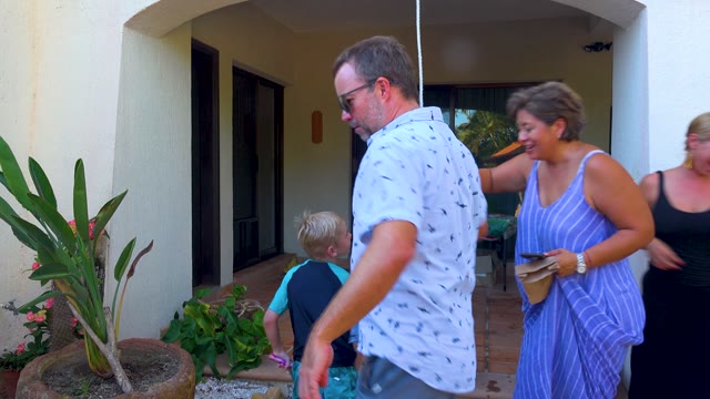 SAN JOSE DEL CABO BCS MEXICO-2020: Family Celebrating with Sparklers on an Outdoor Patio