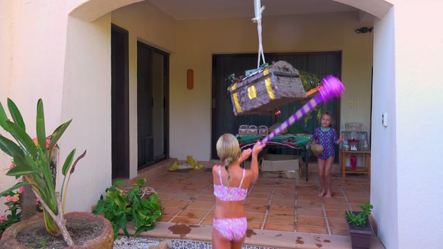 SAN JOSE DEL CABO BCS MEXICO-2020: Child Swinging Stick at Hanging Piñata