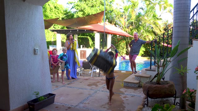 SAN JOSE DEL CABO BCS MEXICO-2020: Child Swinging on a Tire Swing in a Backyard