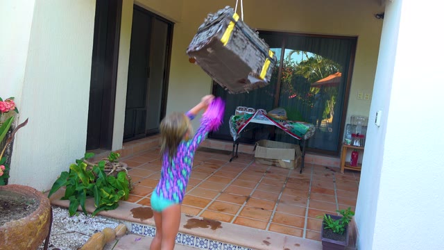SAN JOSE DEL CABO BCS MEXICO-2020: Child Swinging Stick at Hanging Piñata