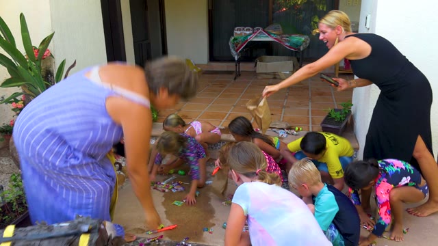 SAN JOSE DEL CABO BCS MEXICO-2020: Adults and Children Collecting Treats on a Patio