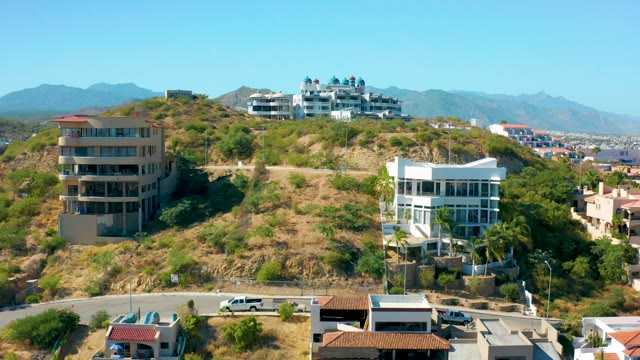 SAN JOSE DEL CABO MEXICO-2020: Hillside Residential Area with Moving Vehicle