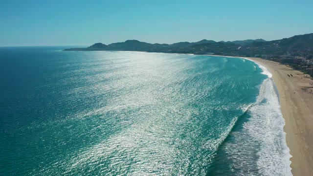 SAN JOSE DEL CABO MEXICO-2020: Waves Rolling In on Sandy Shore
