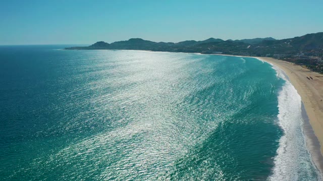 SAN JOSE DEL CABO MEXICO-2020: Gentle Ocean Waves Rolling Toward Sandy Shore
