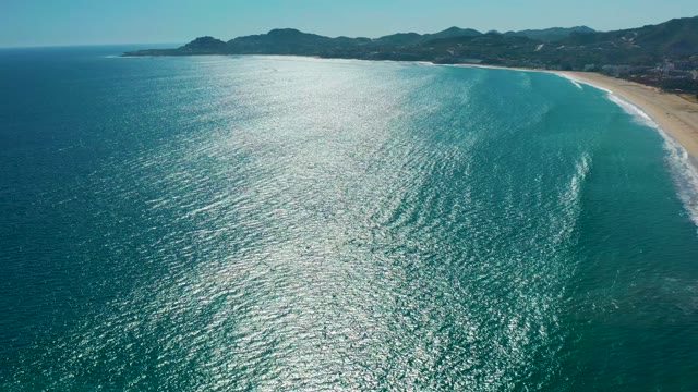 SAN JOSE DEL CABO MEXICO-2020: Gentle Ocean Waves Approaching Curved Sandy Beach