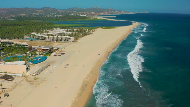 SAN JOSE DEL CABO MEXICO-2020: Sandy Beach with Resort and Ocean Waves