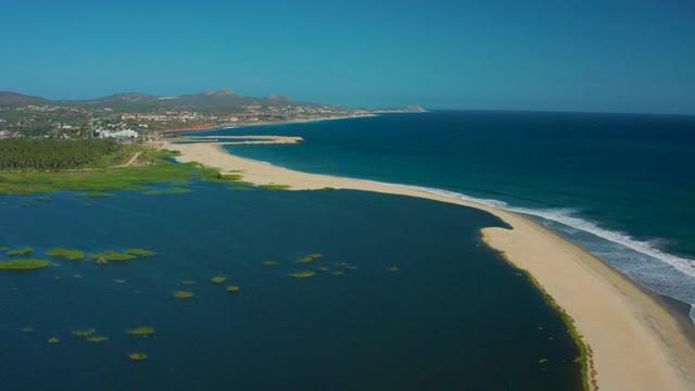 SAN JOSE DEL CABO MEXICO-2020: Sandy Shore and Lagoon with Moving Ocean Waves