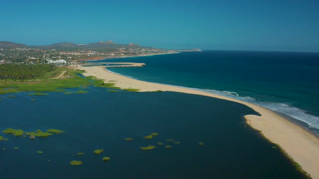SAN JOSE DEL CABO MEXICO-2020: Narrow Sandy Beach Between Lagoon and Ocean