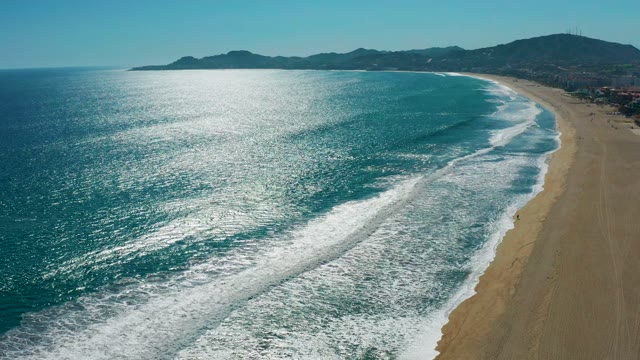 SAN JOSE DEL CABO MEXICO-2020: Ocean Waves Rolling Onto Sandy Shoreline