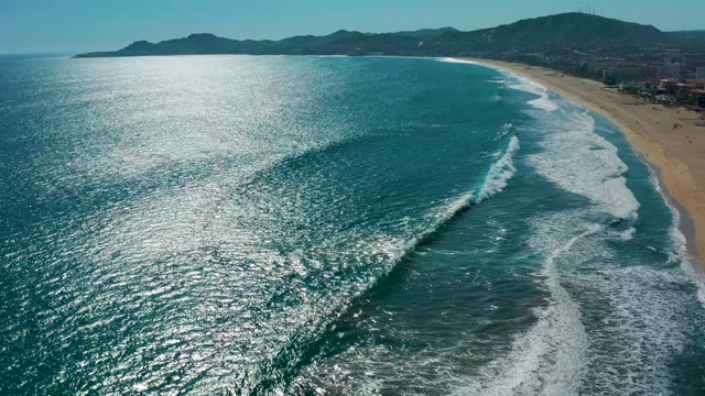 SAN JOSE DEL CABO MEXICO-2020: Waves Rolling Toward Sandy Beach Shore
