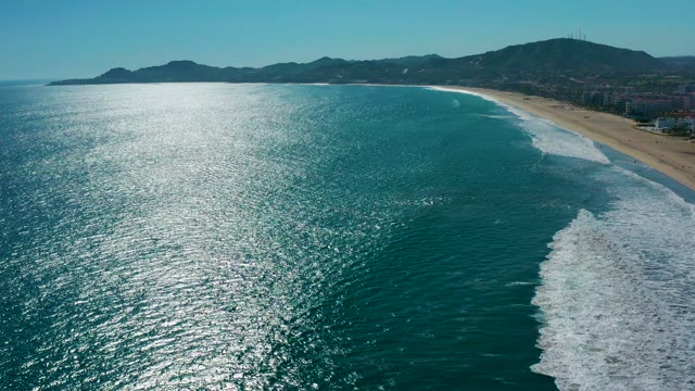 SAN JOSE DEL CABO MEXICO-2020: Ocean Waves Crashing Onto Sandy Shoreline