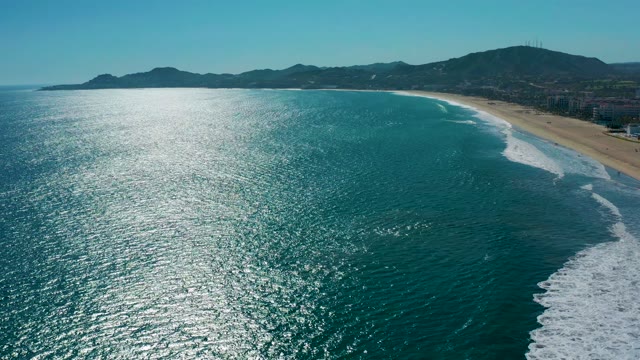 SAN JOSE DEL CABO MEXICO-2020: Gentle Ocean Waves Rolling Onto Sandy Shore