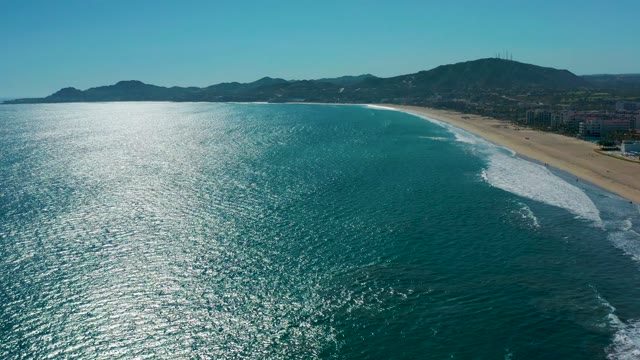 SAN JOSE DEL CABO MEXICO-2020: Gentle Ocean Waves Rolling Onto Sandy Shore