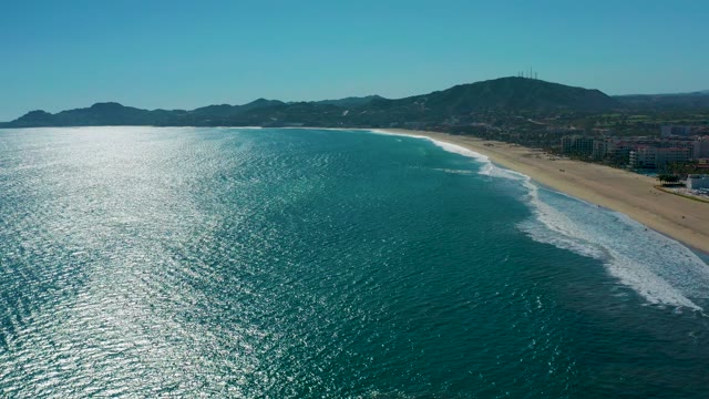 SAN JOSE DEL CABO MEXICO-2020: Gentle Ocean Waves Lapping a Sandy Beach