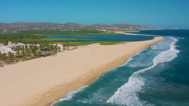 SAN JOSE DEL CABO MEXICO-2020: Sandy Beach with Ocean Waves and Coastal Lagoon