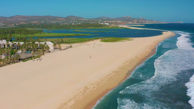 SAN JOSE DEL CABO MEXICO-2020: Sandy Beach with Ocean Waves and Lagoon