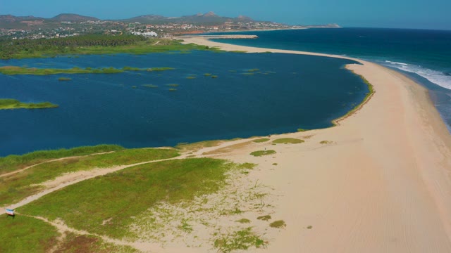 SAN JOSE DEL CABO MEXICO-2020: Sandy Beach and Coastal Lagoon with Distant Hills