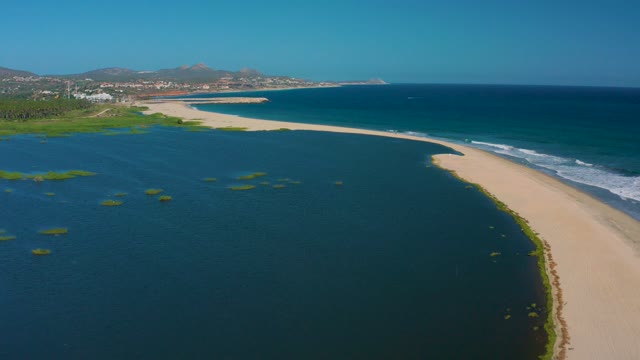 SAN JOSE DEL CABO MEXICO-2020: Gentle Waves Lapping Sandy Coastal Shore