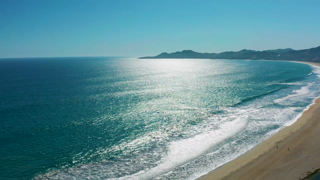 SAN JOSE DEL CABO MEXICO-2020: Waves Rolling Onto Sandy Beach Shoreline