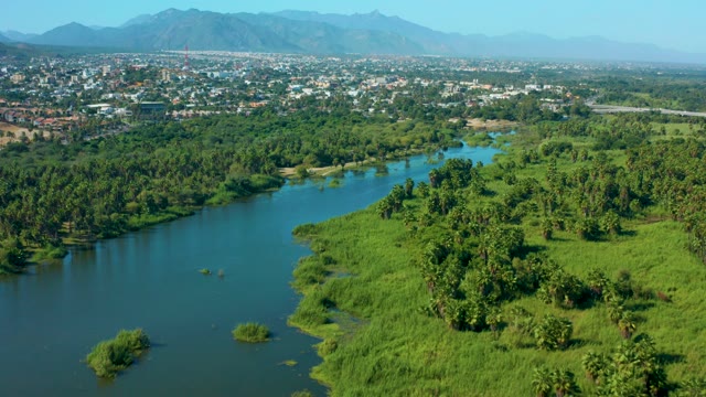 SAN JOSE DEL CABO MEXICO-2020: Winding River Through Lush Greenery and Town