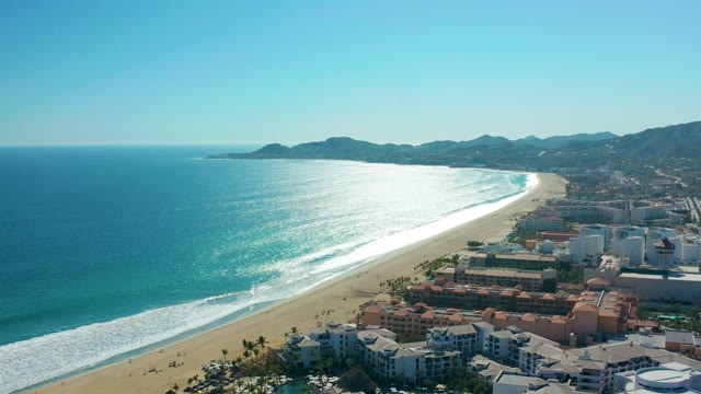SAN JOSE DEL CABO MEXICO-2020: Sandy Beach and Ocean with Coastal Buildings