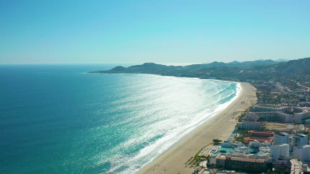 SAN JOSE DEL CABO MEXICO-2020: Gentle Ocean Waves Rolling Onto Sandy Beach