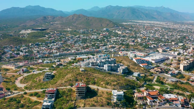 SAN JOSE DEL CABO MEXICO-2020: Hilltop Buildings Overlooking City with Mountain Backdrop