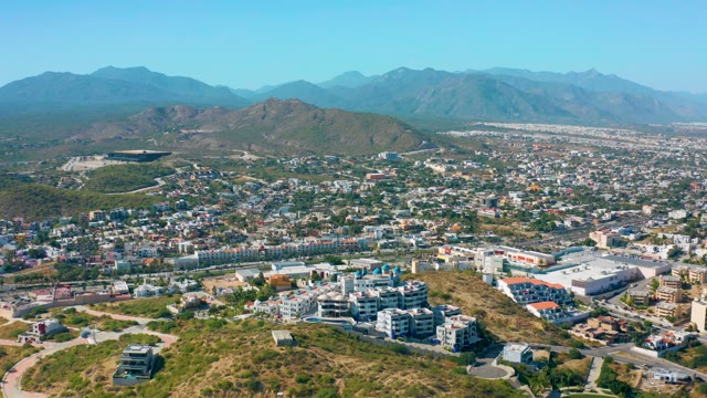 SAN JOSE DEL CABO MEXICO-2020: Aerial Pan of Urban Area with Mountain Backdrop