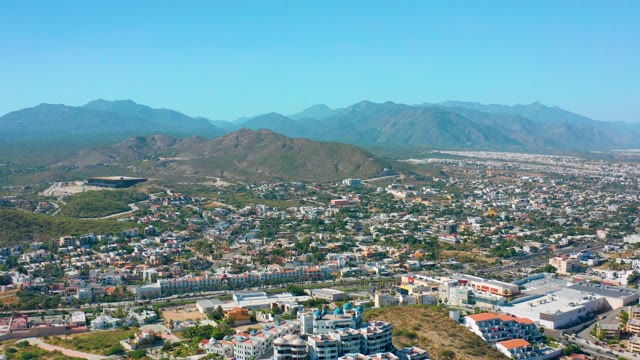 SAN JOSE DEL CABO MEXICO-2020: City Traffic Flow with Mountain Backdrop