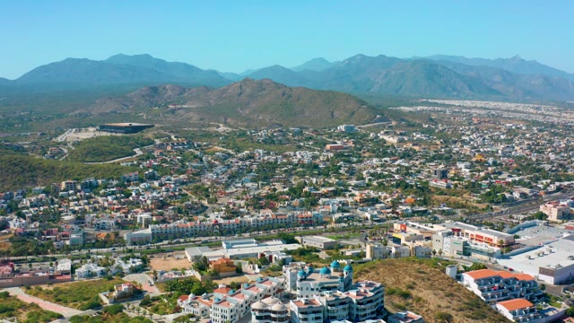 SAN JOSE DEL CABO MEXICO-2020: Urban Landscape with Mountain Backdrop During Aerial Descent