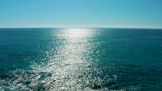 SAN JOSE DEL CABO BCS MEXICO-2020: Boat Wake Moving Past Rocks in the Ocean