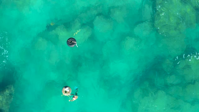 SAN JOSE DEL CABO BCS MEXICO-2020: People Floating on Inflatable Rings in Clear Water