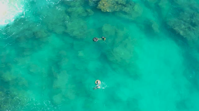 SAN JOSE DEL CABO BCS MEXICO-2020: People Floating and Swimming in Clear Turquoise Water
