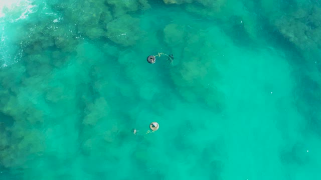 SAN JOSE DEL CABO BCS MEXICO-2020: People Swimming and Floating in Clear Turquoise Water