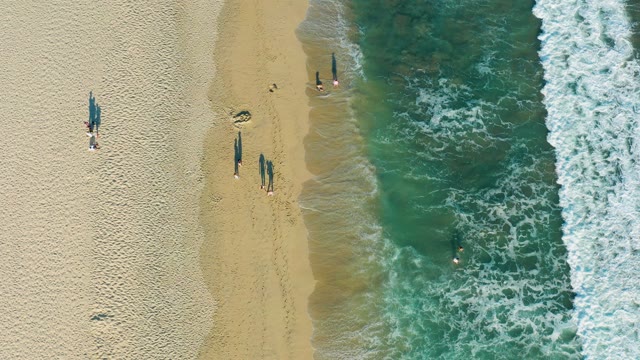 SAN JOSE DEL CABO BCS MEXICO-2020: Beachgoers Moving Along Shoreline and in Water