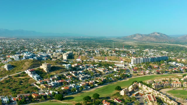 SAN JOSE DEL CABO BCS MEXICO-2020: Residential Neighborhood with Moving Vehicles and Distant Mountains