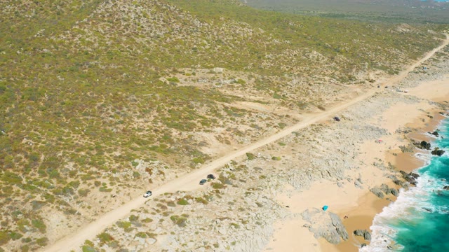 EAST CAPE BCS MEXICO-2020: Vehicles Traveling Along a Coastal Dirt Road