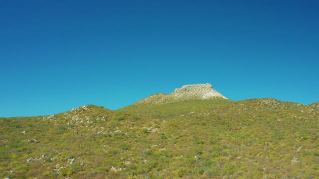 EAST CAPE BCS MEXICO-2020: Rolling Hills with Rocky Peak Under Clear Sky